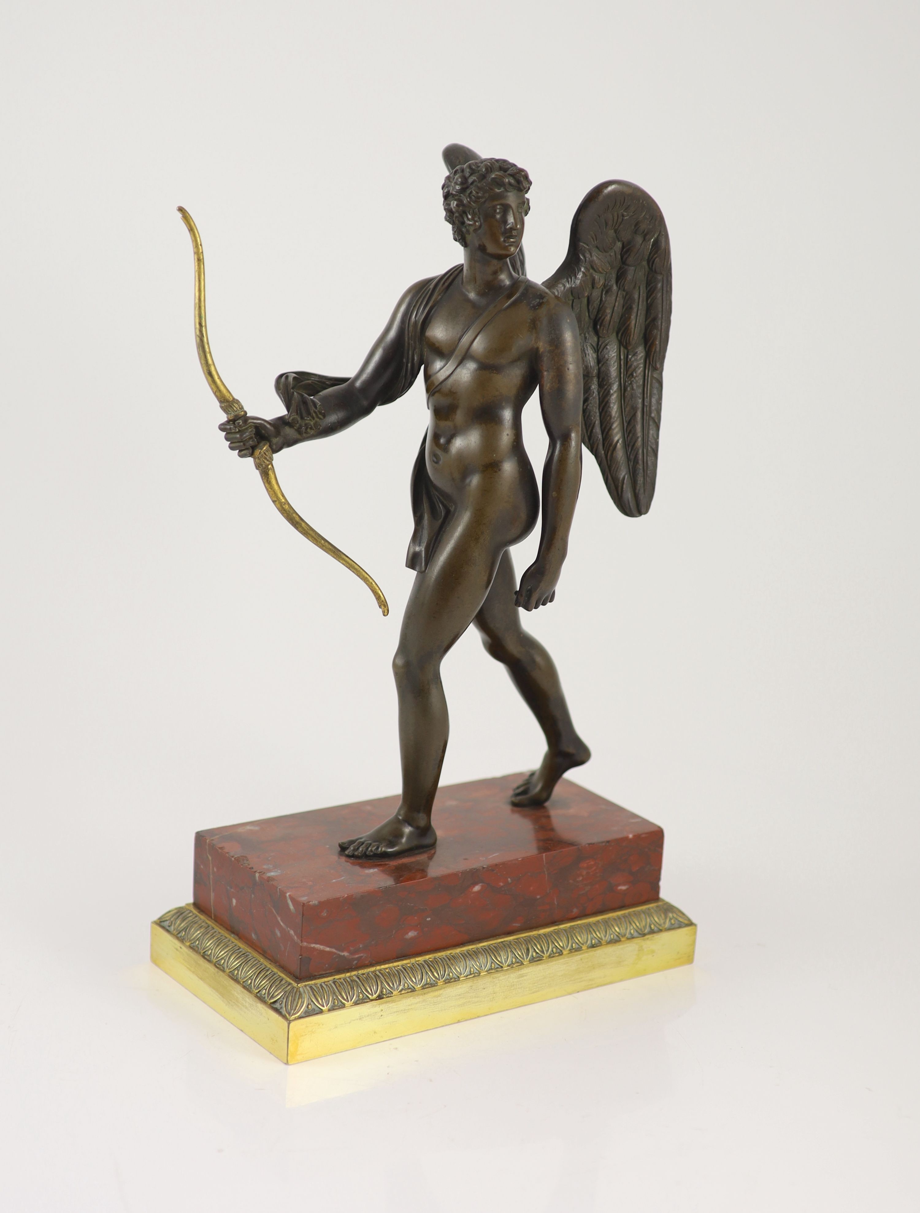 A 19th century bronze figure of Eros, H 37cm. W 22cm. D 12cm.